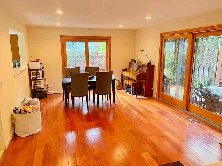 from living room towards dining area. Doors on right go to main deck.