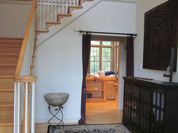 Elegant hardwood entry flanked by DR and LR