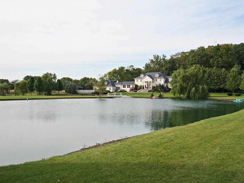 Incredible 20+ acre estate with private lakes and wooded grounds.