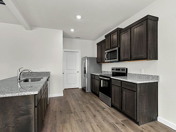 The kitchen has a wonderful breakfast bar.