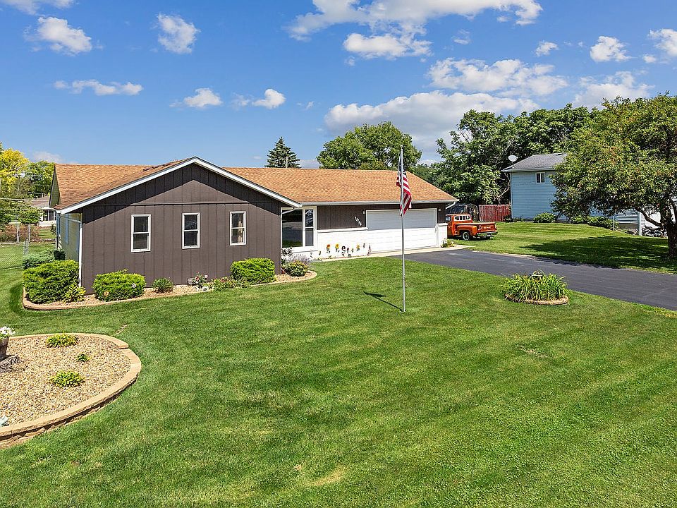 Freshly painted and nicely landscaped, this Ranch home has a quarter up brick front with vertical wo