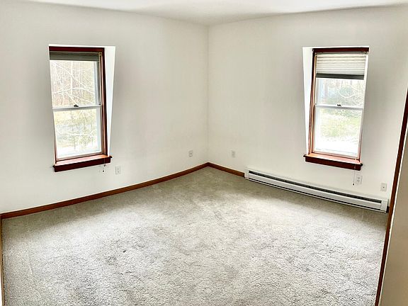 bedroom (12x11) carpet and large double door closet