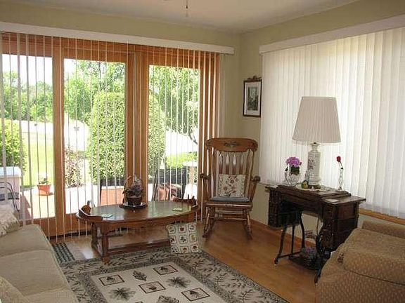 Den/Sun Room   Relax in this sun drenched room with adjoining patio!