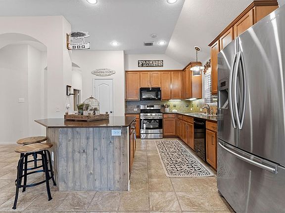 Spacious kitchen with large breakfast bar.