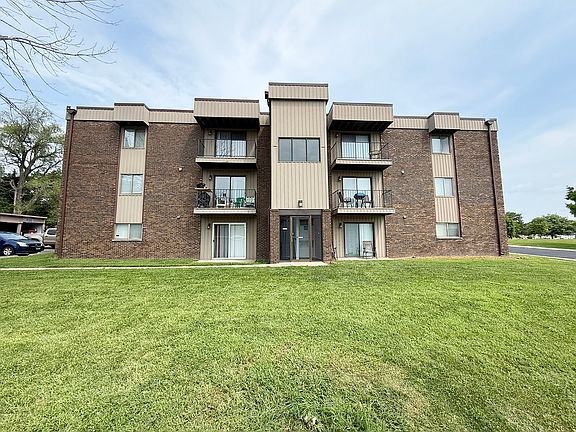 REAR EXTERIOR - COMMON GREEN SPACE - CONTROLLED ENTRANCE