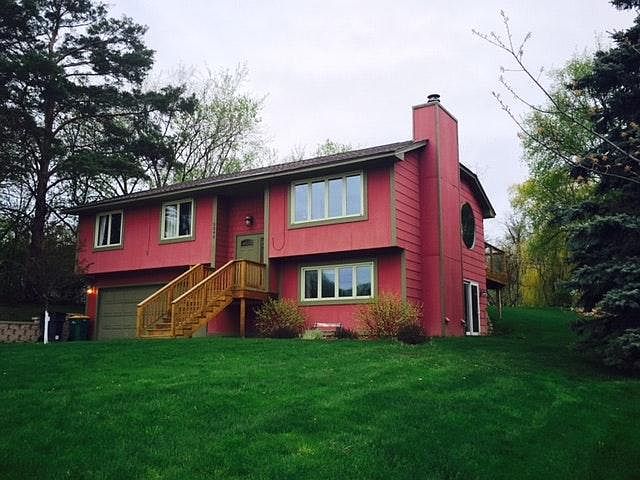 Front View of House, pond to far right of house in backyard.