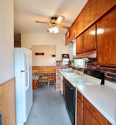 Kitchen with eat-in nook straight ahead.