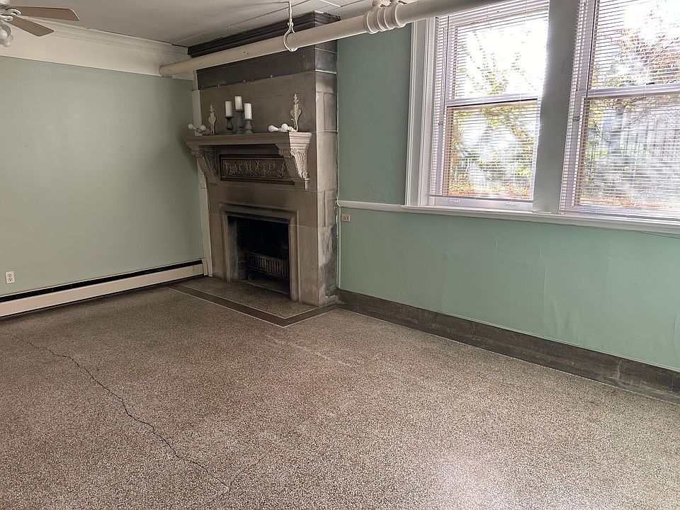 Living area with decorative fireplace.