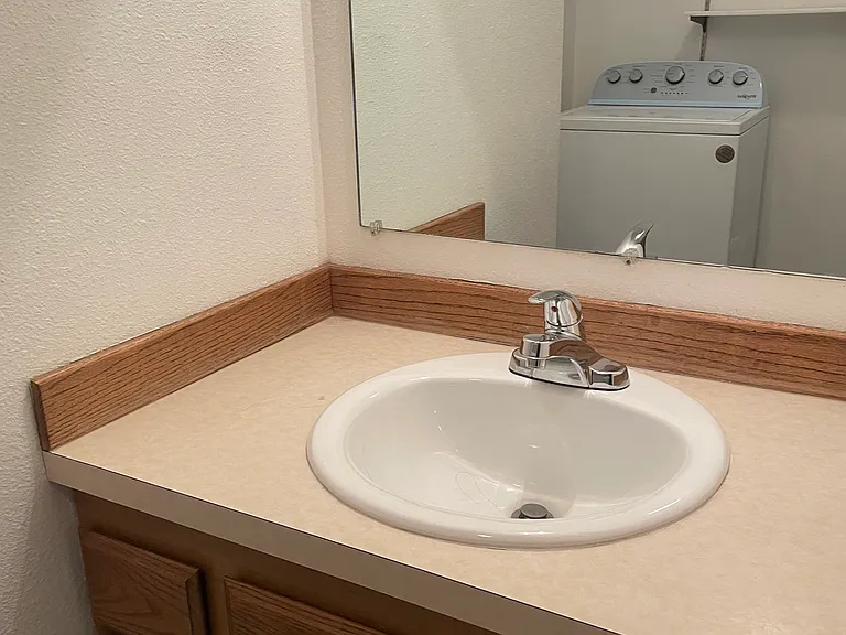 Half bath with washer and dryer.