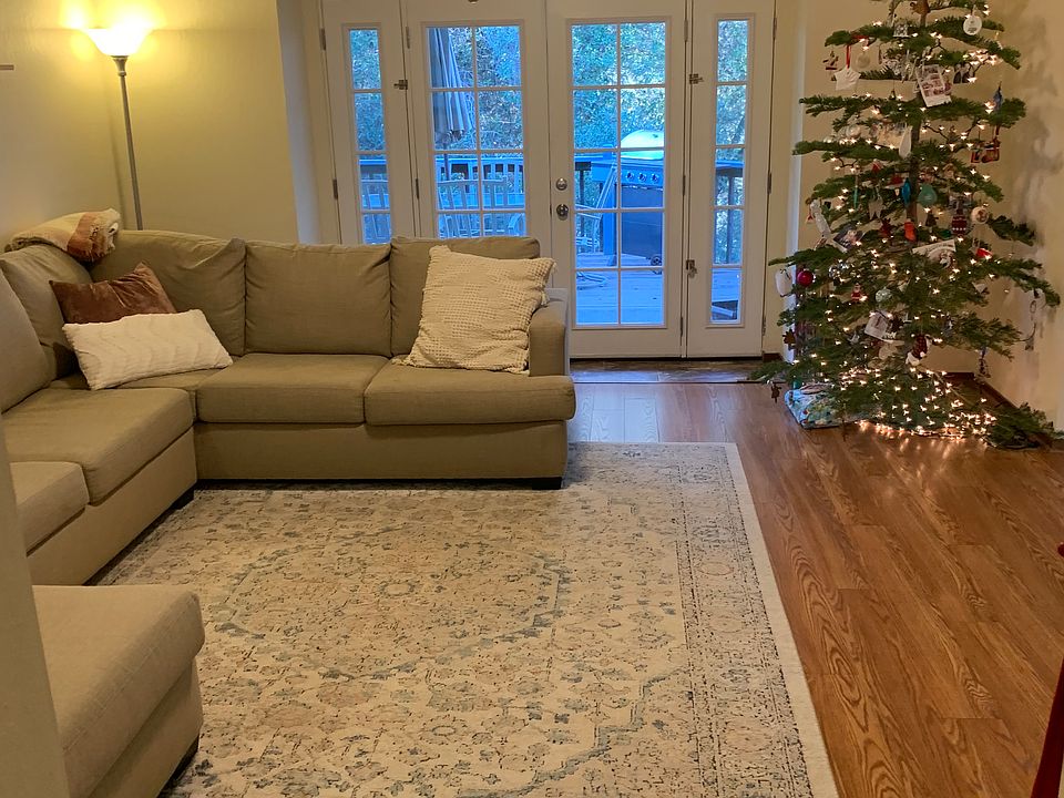 Living room with French doors leading onto covered deck.