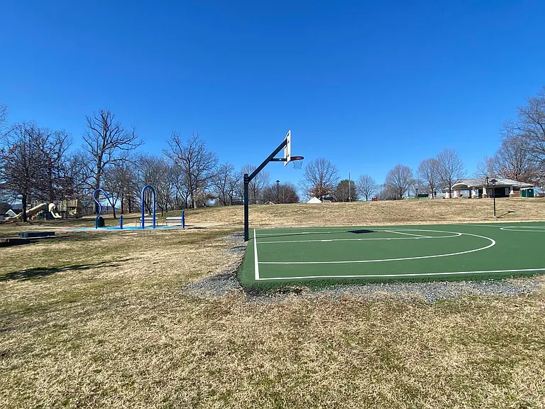 Access to park with playground and sport courts