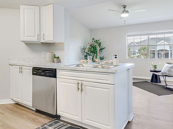Delight in the beautiful open kitchen design with a breakfast bar, fostering a harmonious connection between culinary artistry and relaxed living.