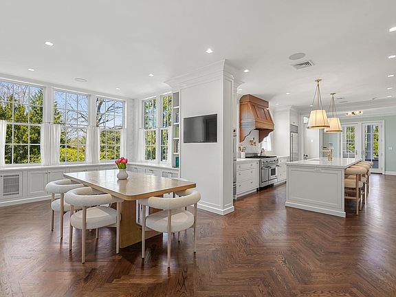 Fully renovated eat in kitchen and breakfast area with new herringbone white oak floors