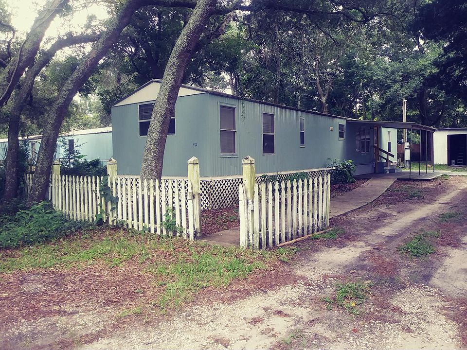 Private fully shaded lot with off street parking and covered front porch