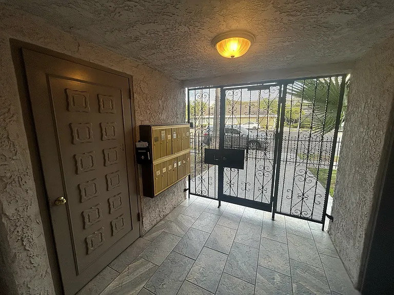 building lobby. mailboxes pictured on left