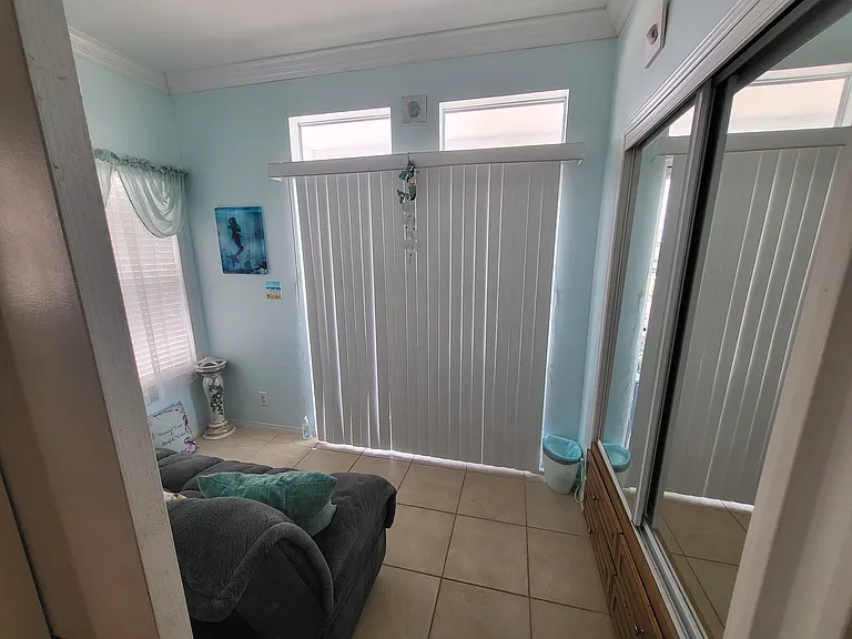 Front Room with Futon and another large closet, deep and tall for plenty of storage space, drawers under