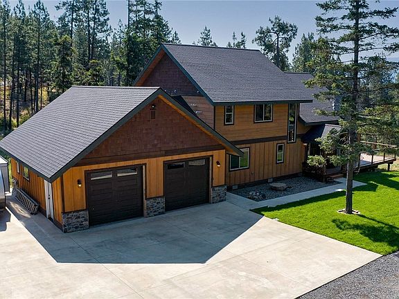 Gorgeous Extended Driveway and Carport to include RV Parking with 30/50AMP and an onsite RV Clean-Out. Large 8x12 Shed has Heater and Lights.