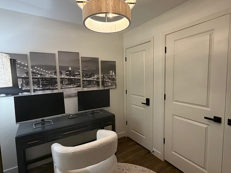 Office with two closets/storage areas. Also washer and dryer area.