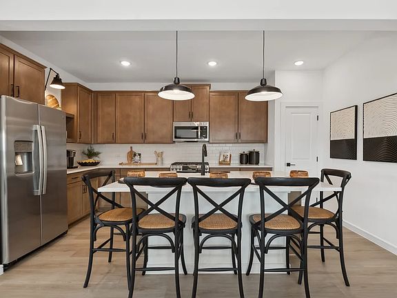 Kitchen with pendant lighting and floating shelves
