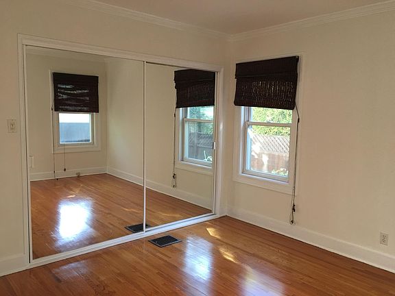 BEDROOM ,HARDWOOD FLOORS,3 WINDOWS OVERLOOKING ABUNDANT VE