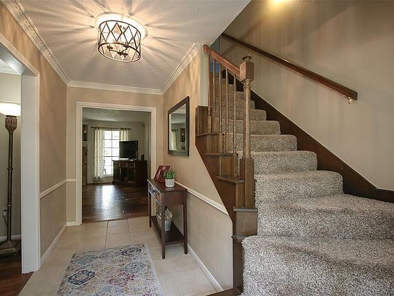 ENTRY - Updated tile & neutral paint in the entry. Light fixture has been updated as well.