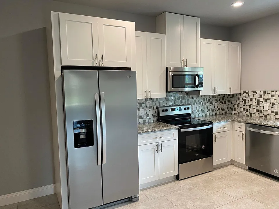 All new appliances. Fridge with ice maker. Range/oven, microwave and dishwasher complimented with beautiful tilework. Lovely granite counters.
