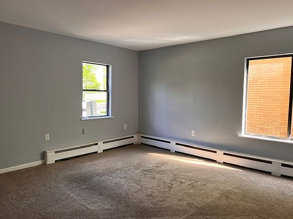 Bright first-floor living room with generous natural light.