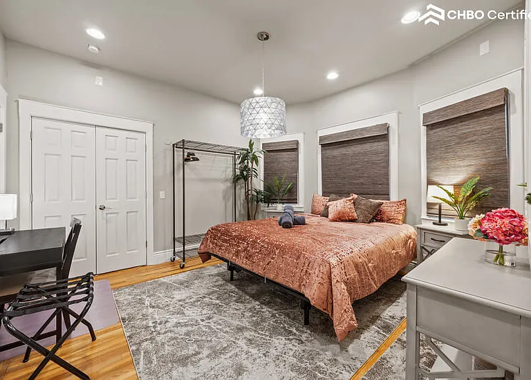 Mainfloor bedroom with California King bed & workspace