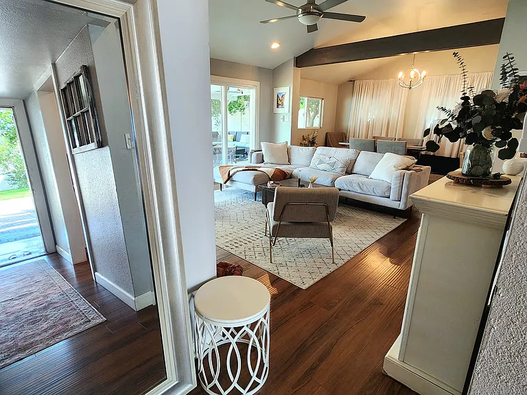 Front Hallway leads into half-open galley kitchen and open living room (rug has since been updated, as seen in earlier photos)