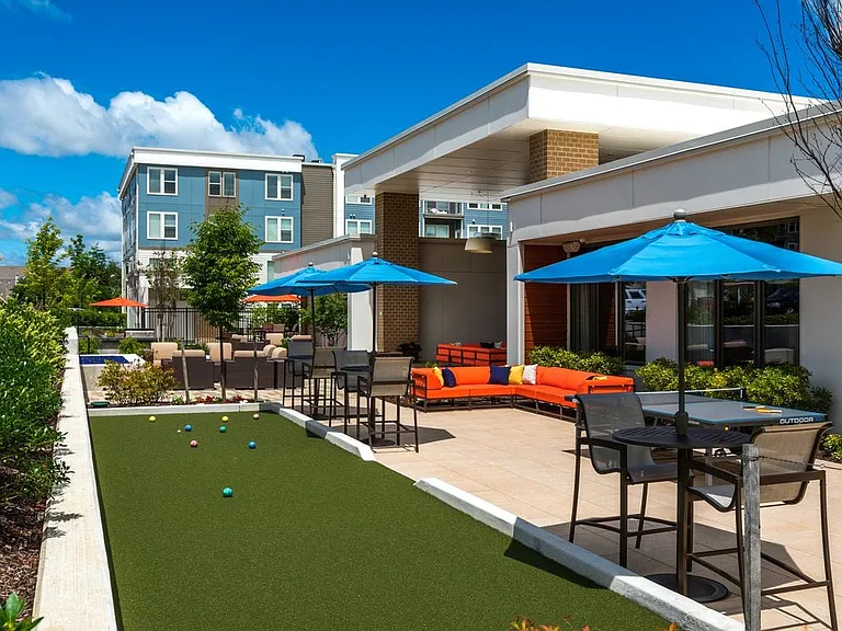 Courtyard with lounge seating, ping-pong table and bocce pit