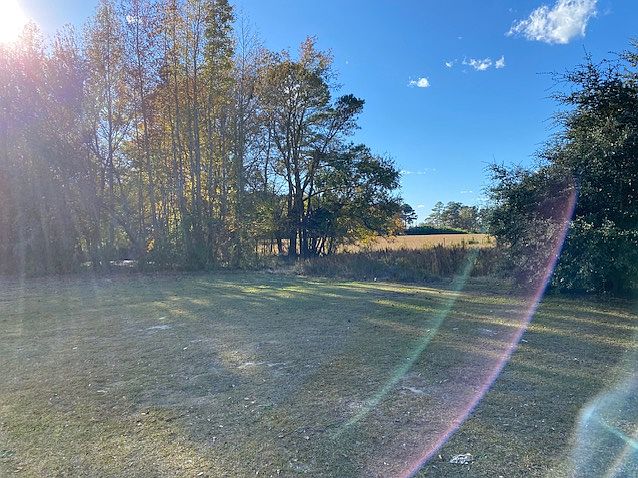 Backs up to pond, green space and acreage