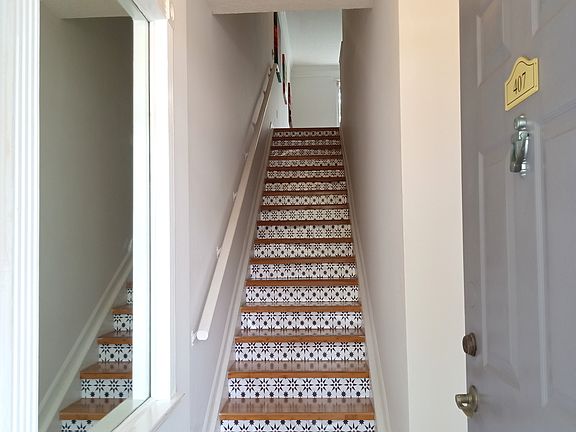 Ground Entrance. There are 2 sets of stairs in the unit. One at entrance (here) and the other from 2nd floor to 3rd floor which houses a bedroom, full bathroom, laundry room, and LARGE closets