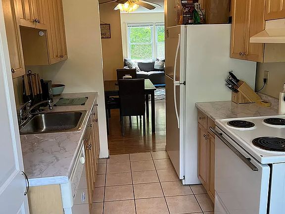 Updated kitchen with soft close drawers. Room for a breakfast table near the window or additional cabinets, storage or prep areas.