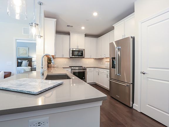 Model Representation - Kitchen with Peninsula Island Provides Ample Workspace and Storage.
