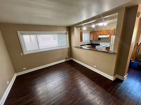 View of living room/kitchen from the front door looking left