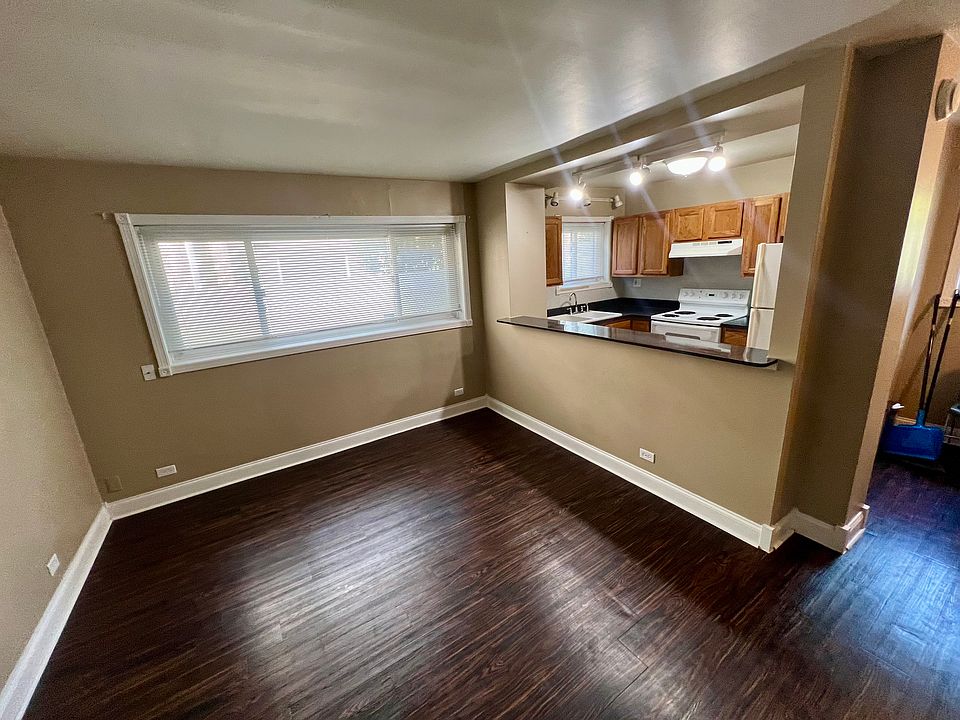 View of living room/kitchen from the front door looking left
