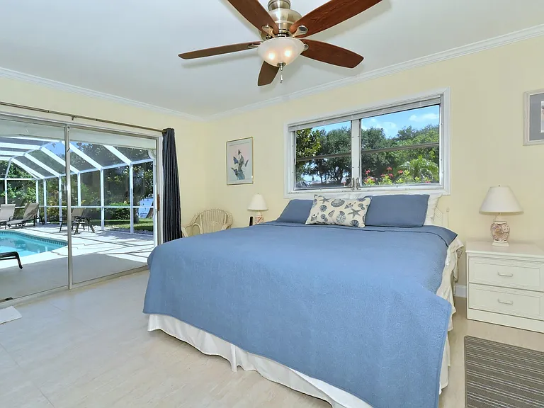Master bedroom with sliders leading out to the pool