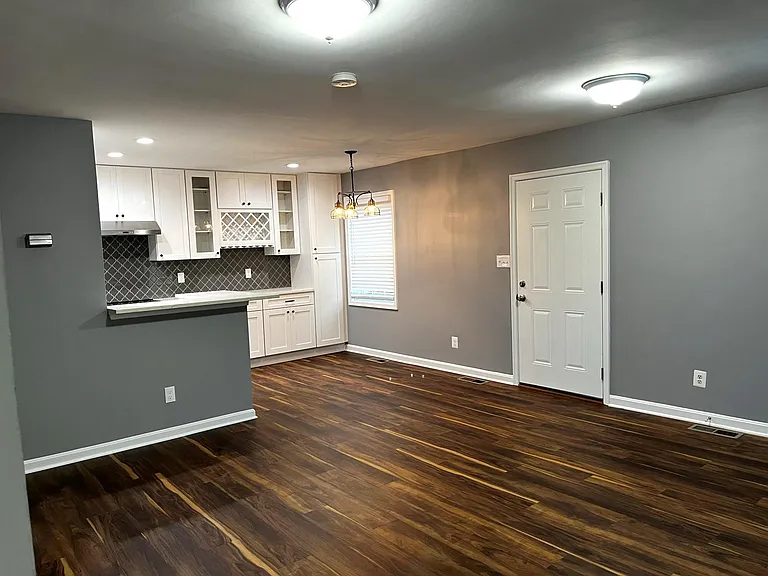 Side door leads to fully fenced patio area for relaxing and entertaining