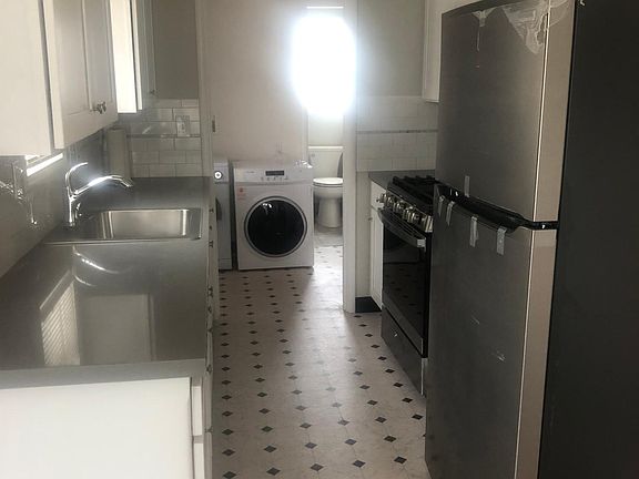 Kitchen with all new appliances, new upper cabs and new fronts on bottom cabs. No dishwasher.