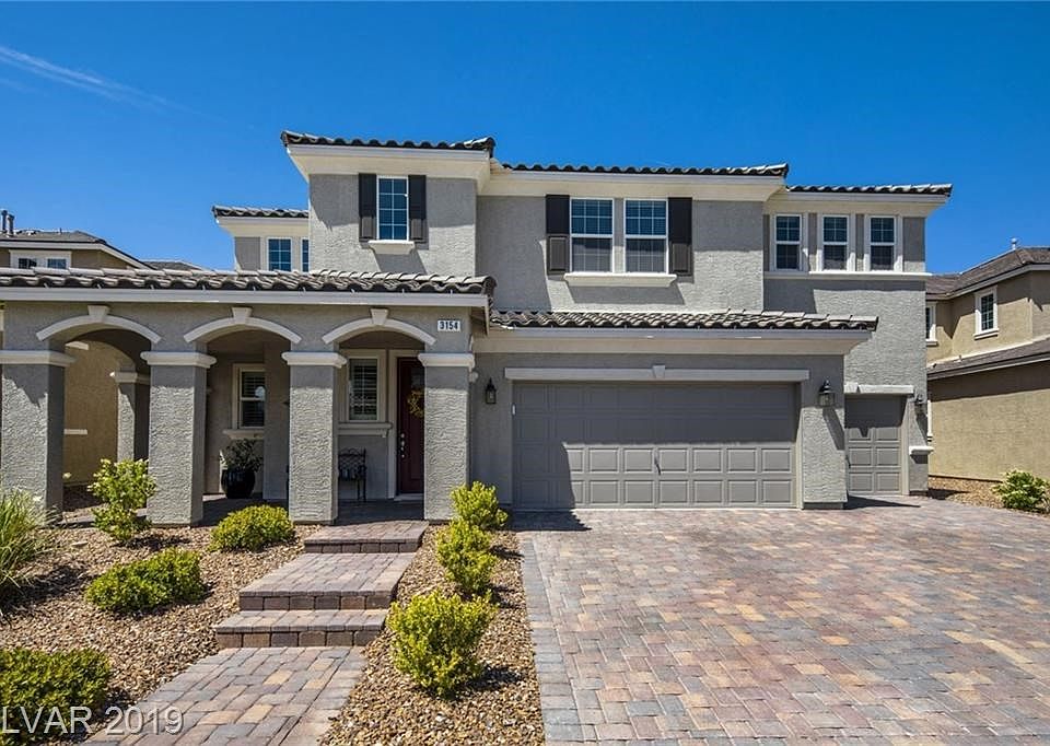 Welcome home to this pristine estate in Porta di Ferro at Inspirada!