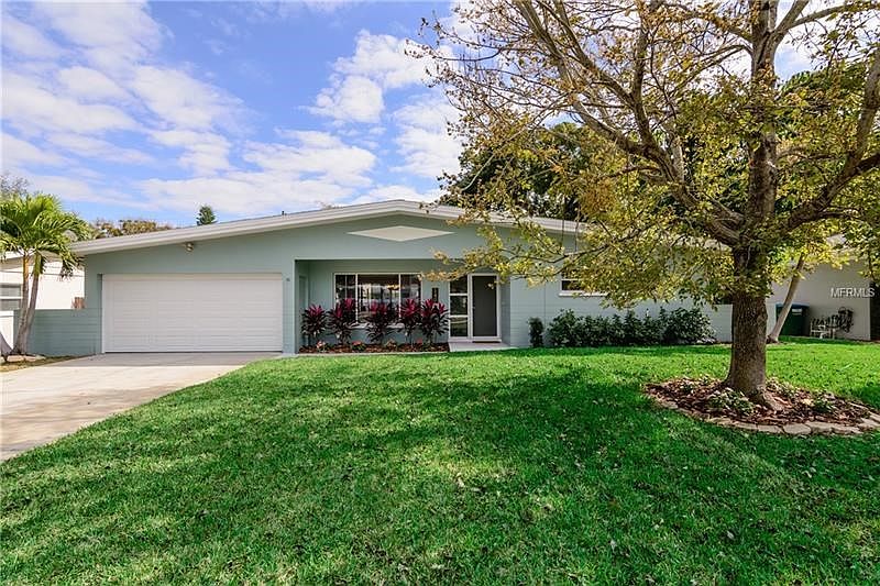 Find your perfect place in the sun! This well-cared for home will win your heart! Block construction. Newer garage door and fron