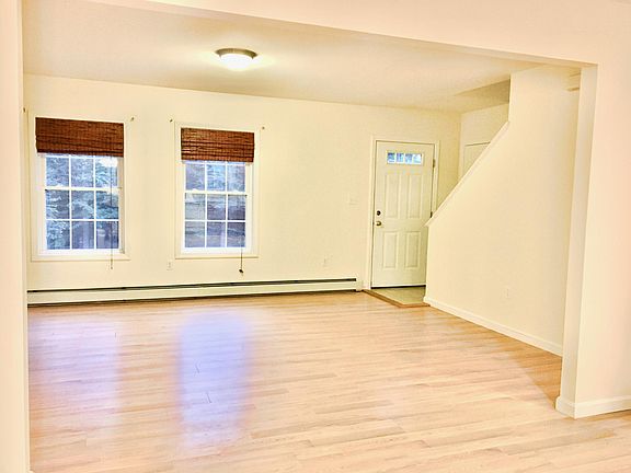 Living room, front door, stairway