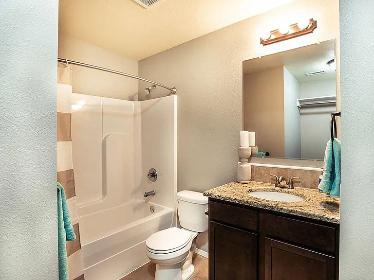Brightly Lit Bathrooms & Large Mirrors