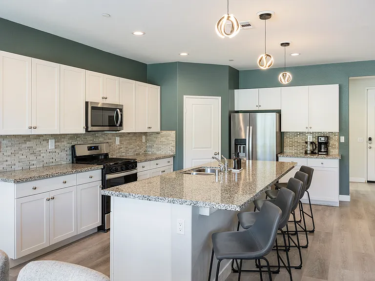 The home features a fully stocked kitchen with everything you need to craft the perfect meal.