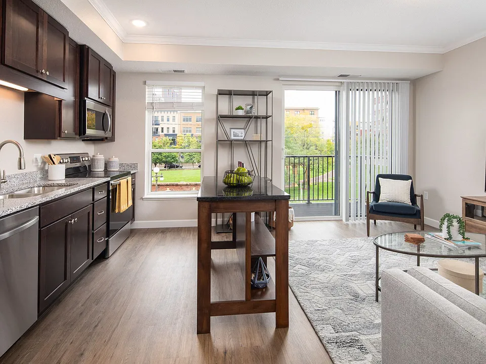 View of kitchen and living room area looking onto the balcony at The Whitley.