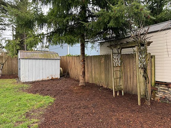 This arbor boasts a beautiful wisteria in spring and early summer.