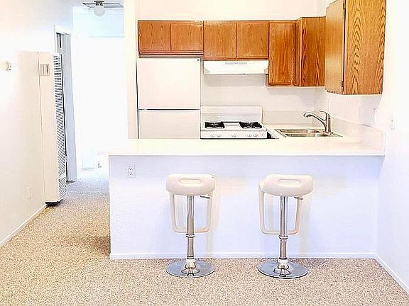 Countertop is about 9' by 7 1/2 ' in length. Comfortable seating for 4 at kitchen countertop bar.
