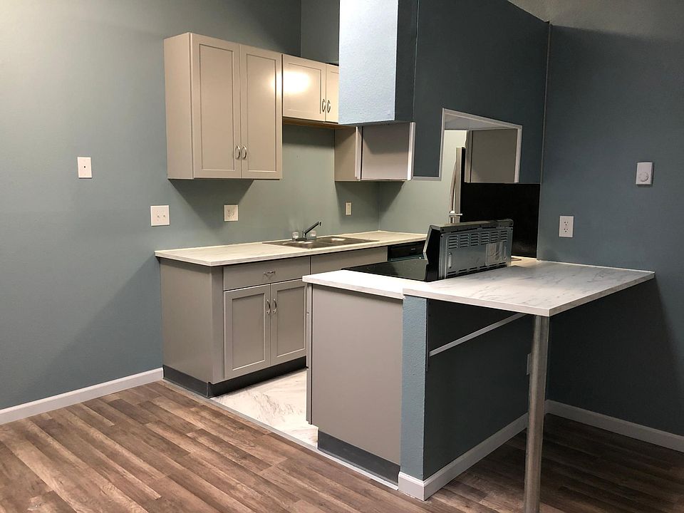 Open concept kitchen connects to living room