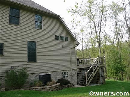Side yard and stairs to large deck