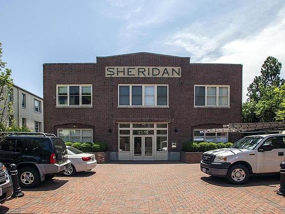 front of building. one of two parking spots is left of entrance (other in underground garage)